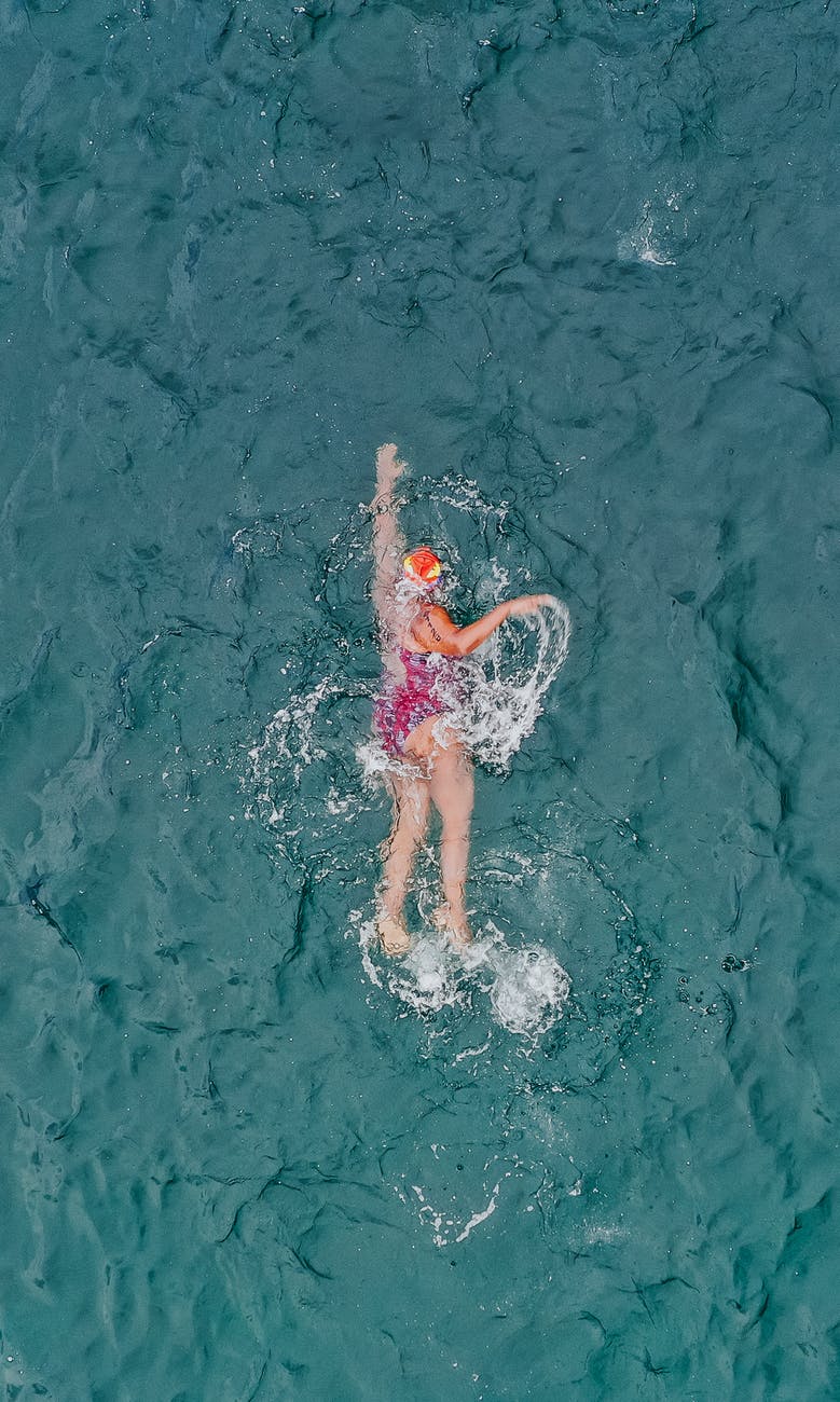 woman swimming professionally in sea water